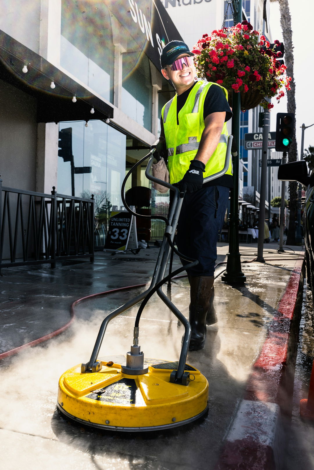a-man-in-a-yellow-vest-is-cleaning-the-street.jpg a man in a yellow vest is cleaning the street